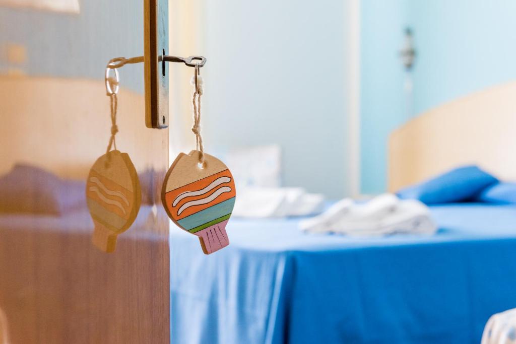 Postel nebo postele na pokoji v ubytování Hotel Stefania