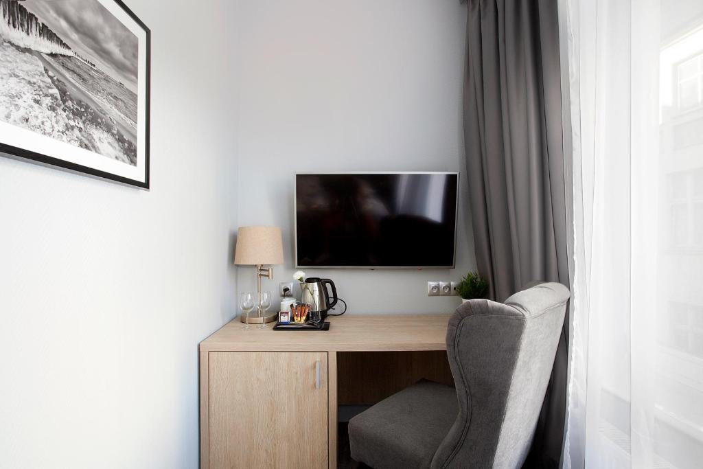 Televízia a/alebo spoločenská miestnosť v ubytovaní Monte Carlo Apartments by OneApartments