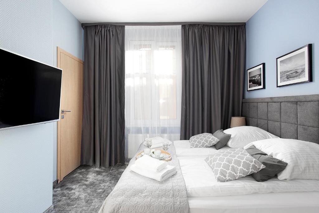 Posteľ alebo postele v izbe v ubytovaní Monte Carlo Apartments by OneApartments