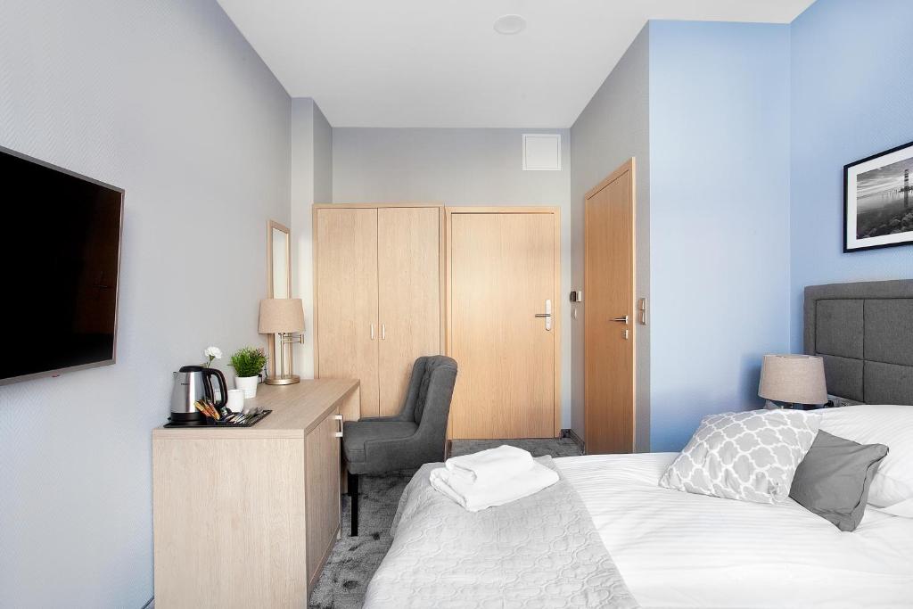 Posteľ alebo postele v izbe v ubytovaní Monte Carlo Apartments by OneApartments