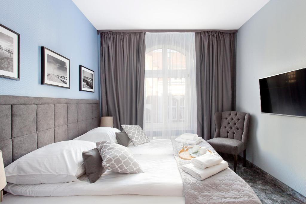 Posteľ alebo postele v izbe v ubytovaní Monte Carlo Apartments by OneApartments