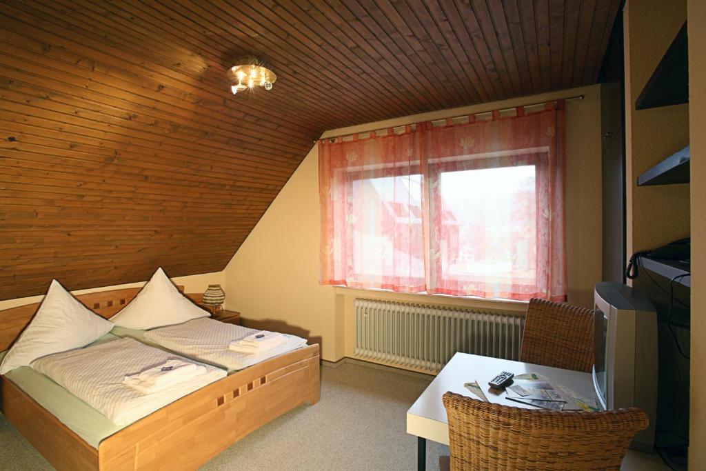 Postel nebo postele na pokoji v ubytování Hotel Steuer
