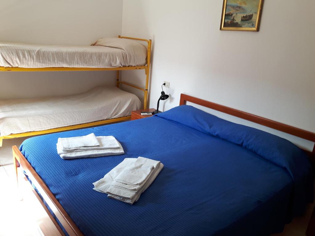 Postel nebo postele na pokoji v ubytování Parigino