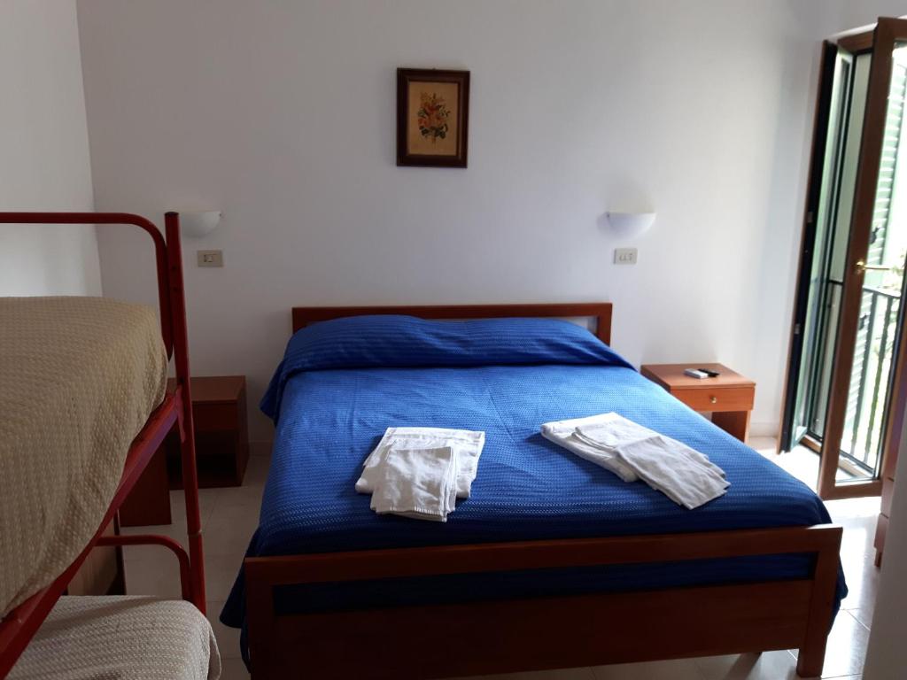 Postel nebo postele na pokoji v ubytování Parigino