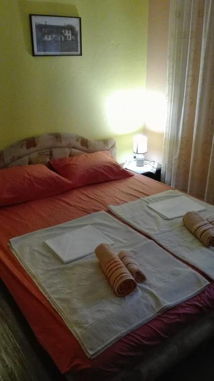 Postel nebo postele na pokoji v ubytování Guesthouse Bato