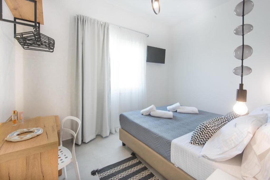 Postel nebo postele na pokoji v ubytování Dimamiel Malia Inn
