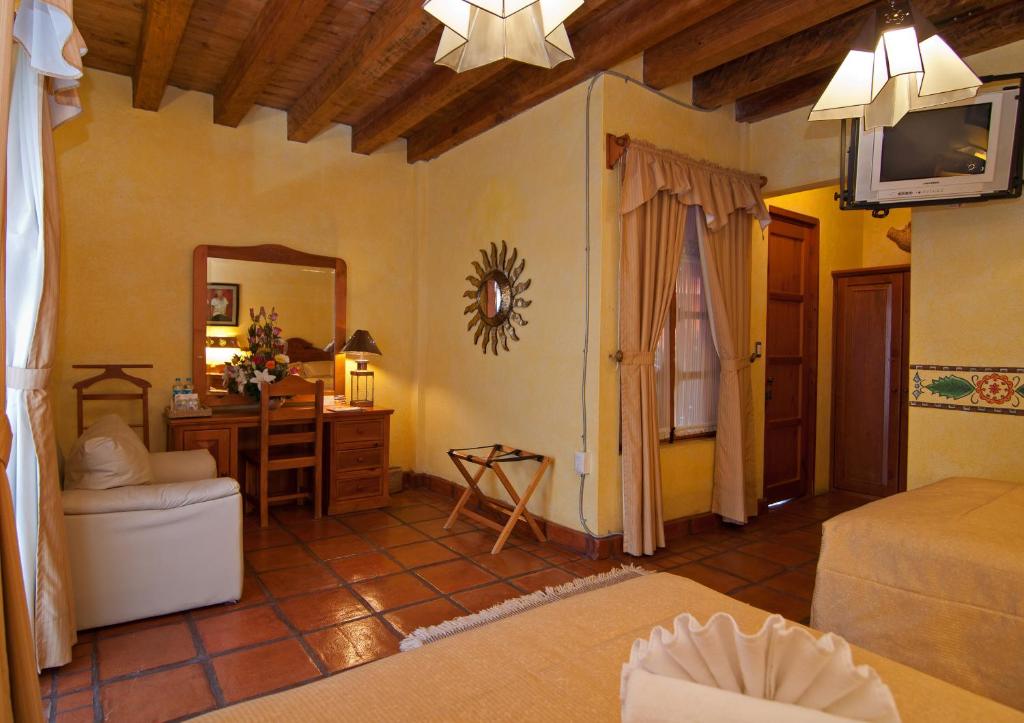 Postel nebo postele na pokoji v ubytování Hotel Pueblo Magico