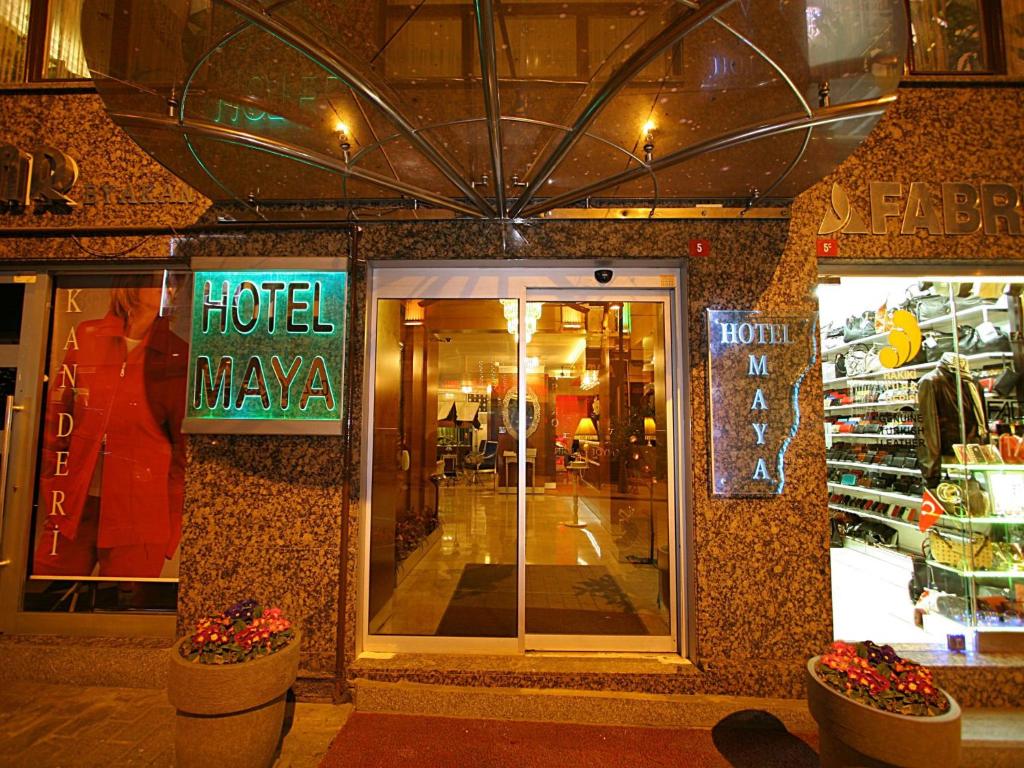 un hotel Maya almacén con un cartel en la puerta en Maya Hotel, en Estambul