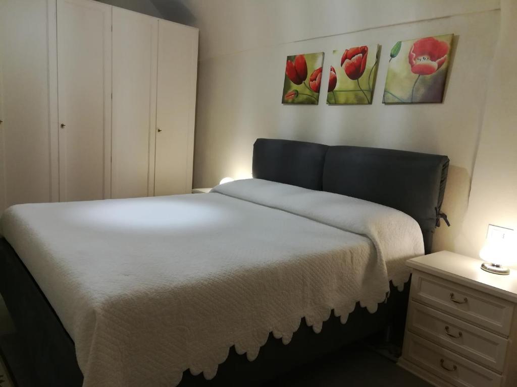 Giường trong phòng chung tại Appartamento I Girasoli