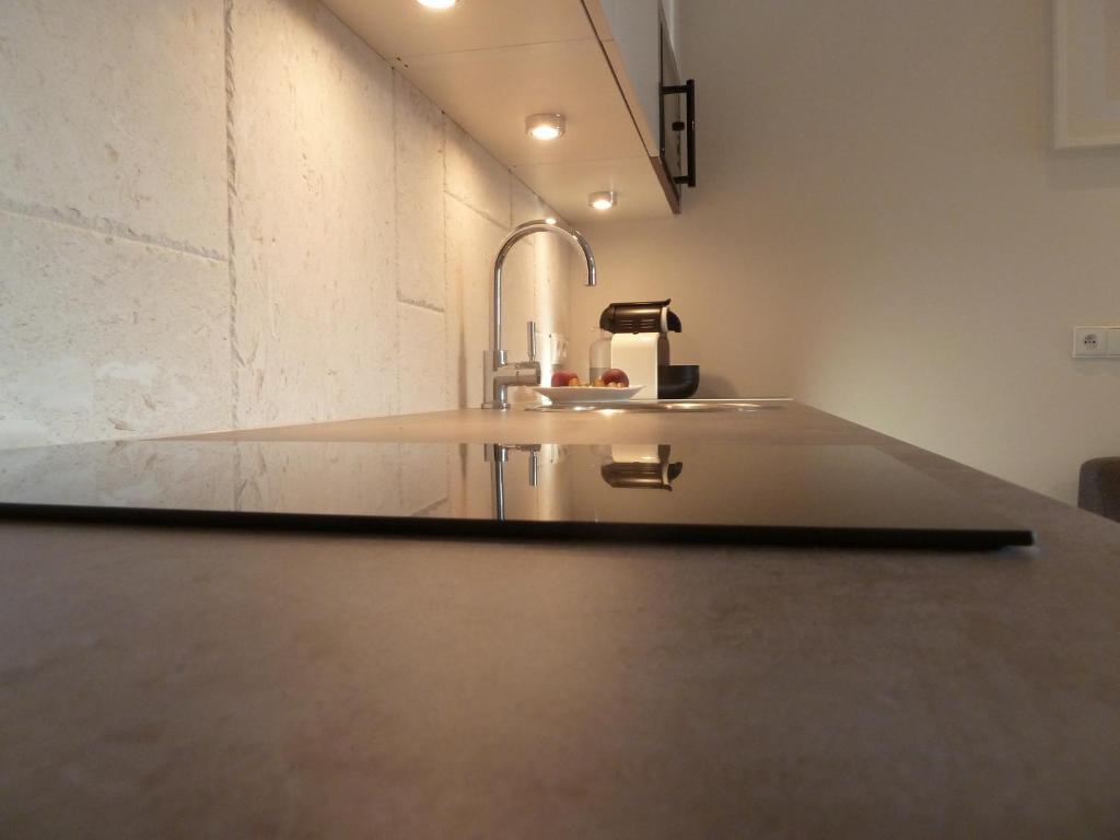 Kuchyňa alebo kuchynka v ubytovaní Tartaczna Deluxe Apartments Gdansk