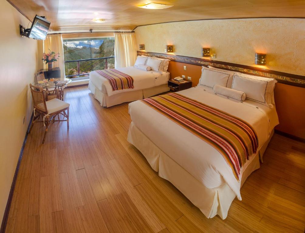 Postel nebo postele na pokoji v ubytování Hotel Taypikala Machupicchu