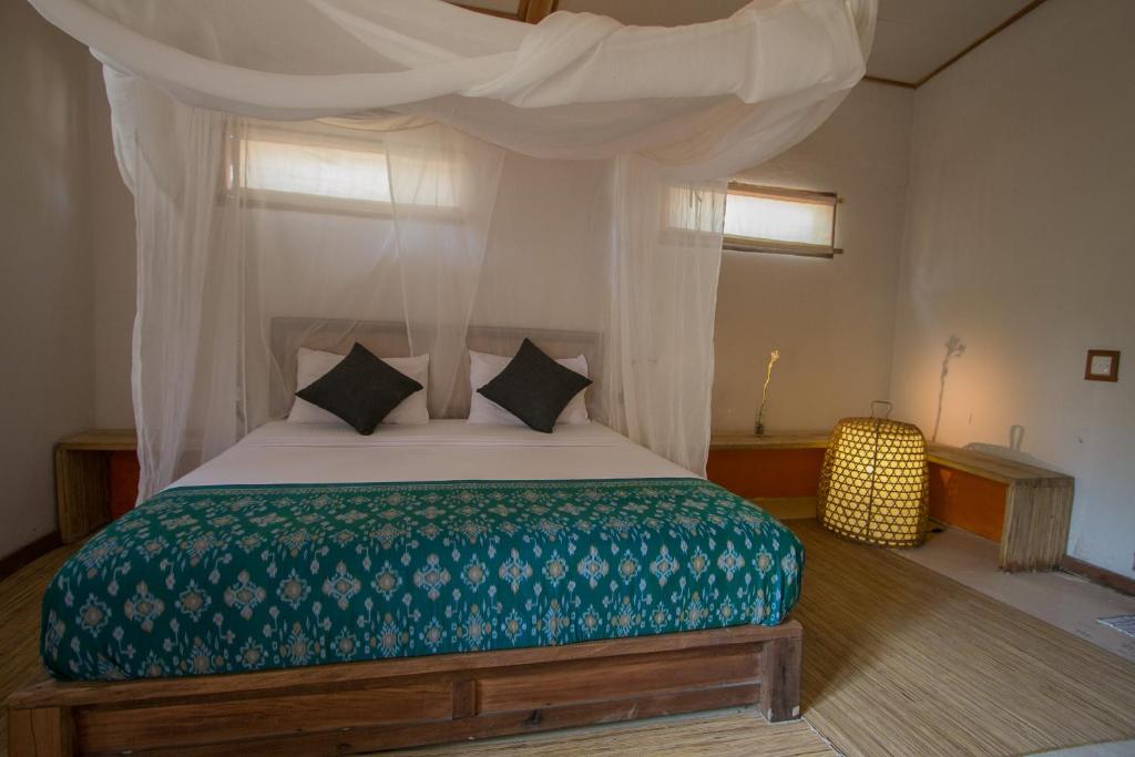 Letto o letti in una camera di MaoMeno Yoga Resort