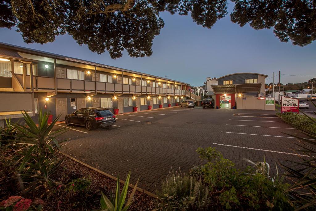 an empty parking lot in front of a building at Landmark Manor in New Plymouth