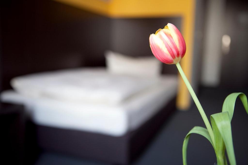 Postel nebo postele na pokoji v ubytování GS Hotel Mindelheim