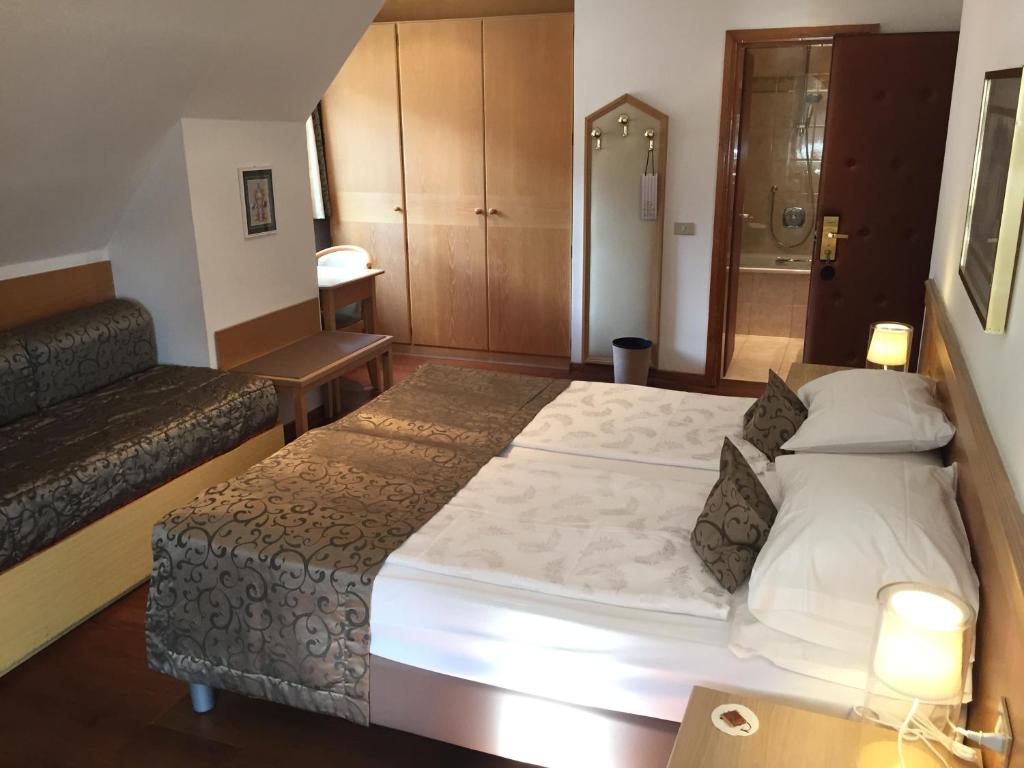 Postel nebo postele na pokoji v ubytování Active Hotel Ancora