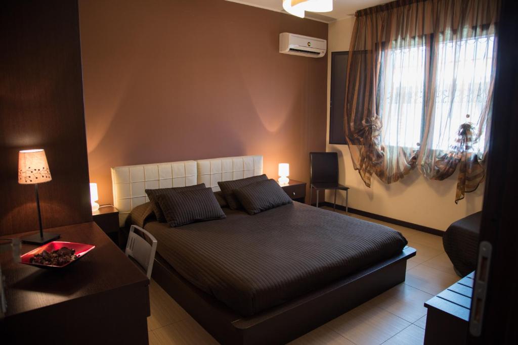 Postel nebo postele na pokoji v ubytování Acitrezza B&B