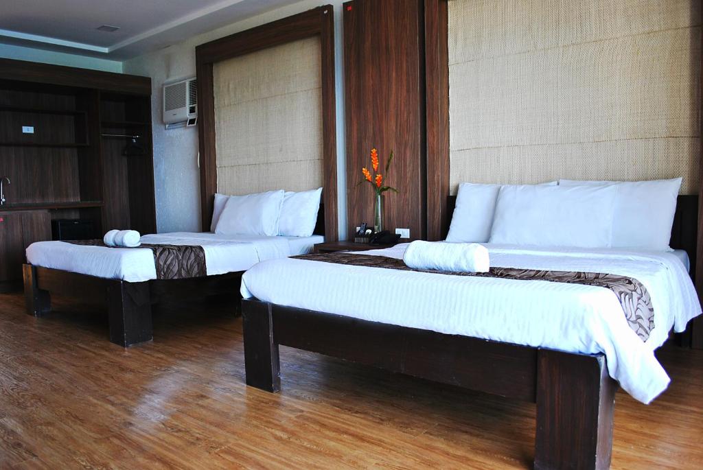 Cama o camas de una habitación en Altamare Dive and Leisure Resort Anilao