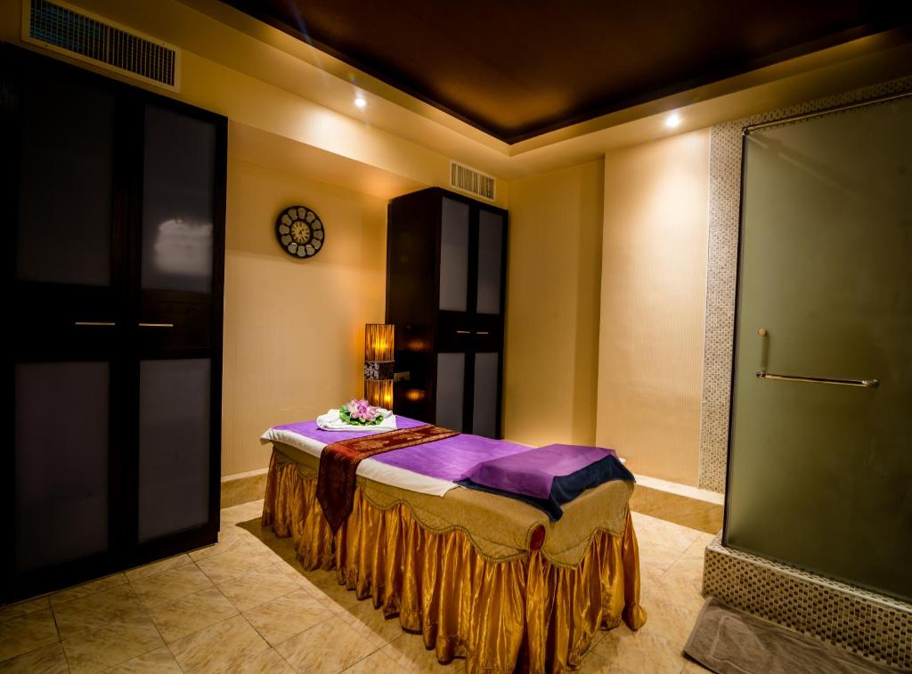 a room with a bed in the corner of a room at The Eclipse Boutique Suites in Abu Dhabi