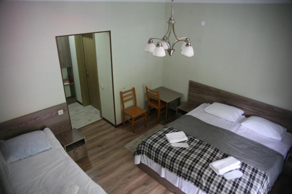 Postel nebo postele na pokoji v ubytování Garden Hotel Pasanauri since 1892