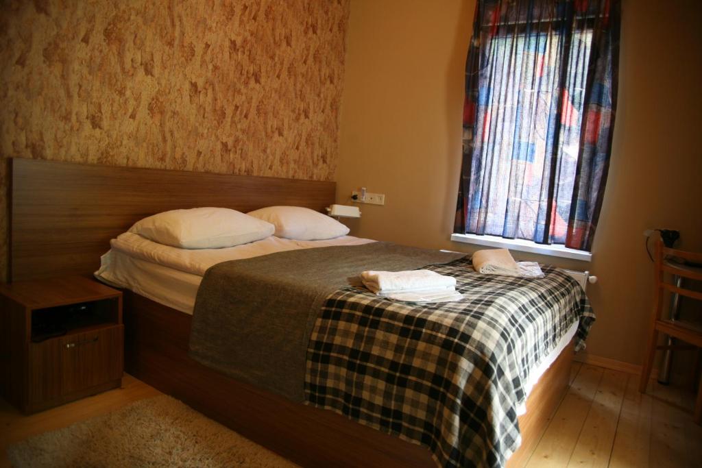 Postel nebo postele na pokoji v ubytování Garden Hotel Pasanauri since 1892