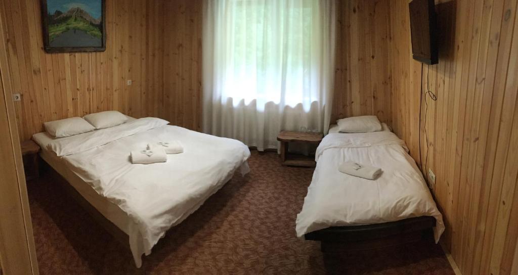 Postel nebo postele na pokoji v ubytování Cheremosh