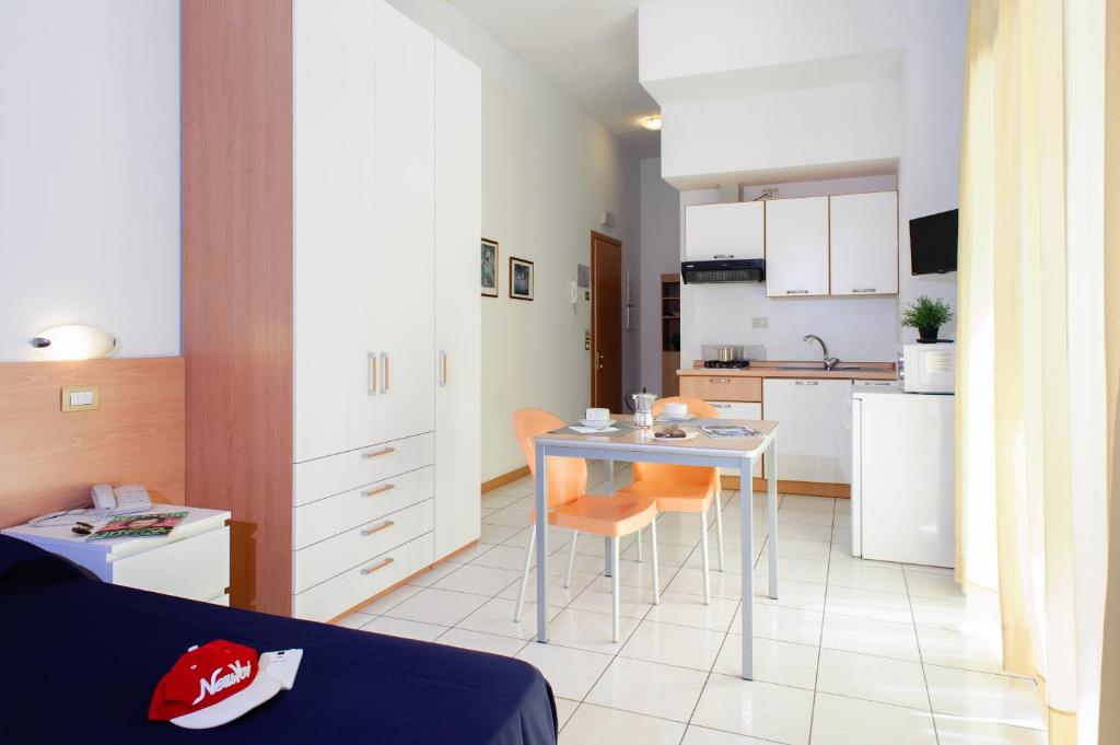 A kitchen or kitchenette at Welcome Residence per famiglie