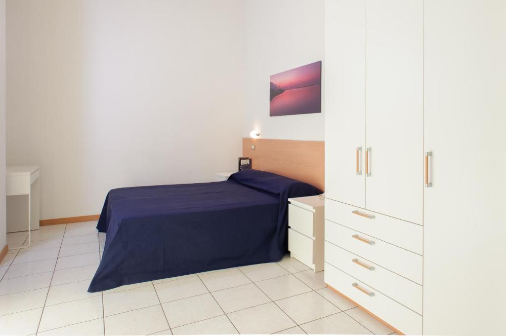 A bed or beds in a room at Welcome Residence per famiglie