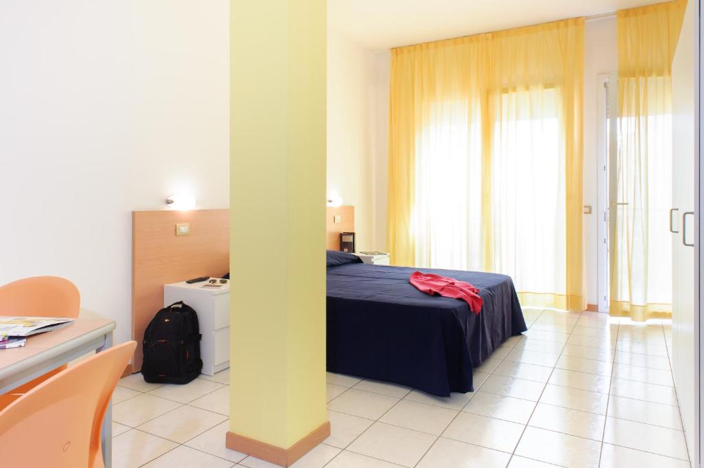 A bed or beds in a room at Welcome Residence per famiglie