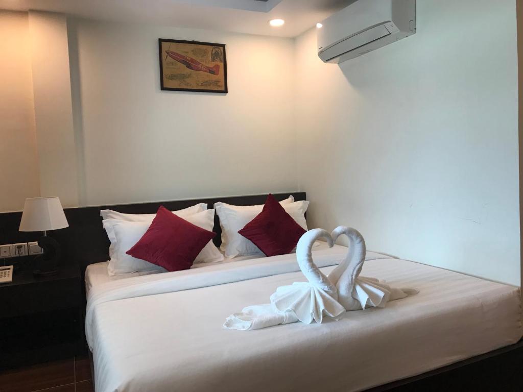 Postel nebo postele na pokoji v ubytování Apple Hotel Two - Near Phnom Penh Airport