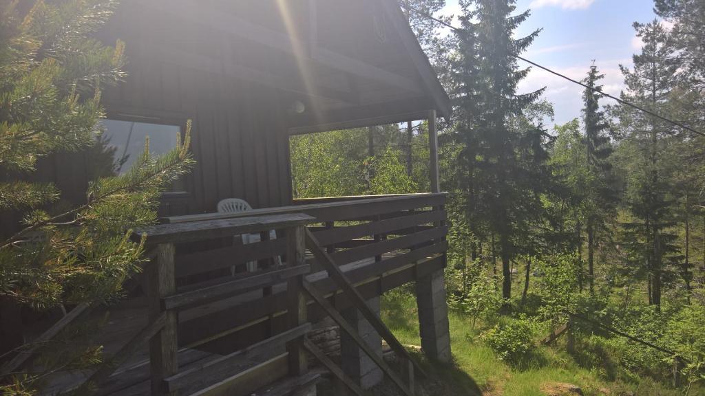 a view of a tree house in the woods at Skogheim Two-Bedroom Cottage in Birkeland