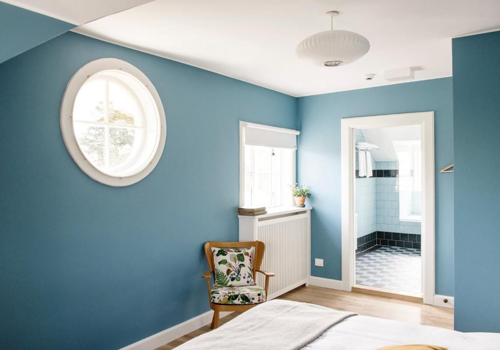 Postel nebo postele na pokoji v ubytování Hotel Hornbækhus