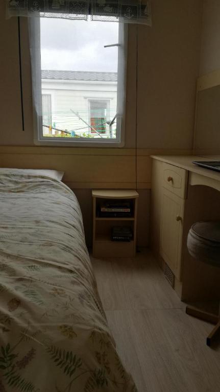 Ein Bett oder Betten in einem Zimmer der Unterkunft Mobil home vacances