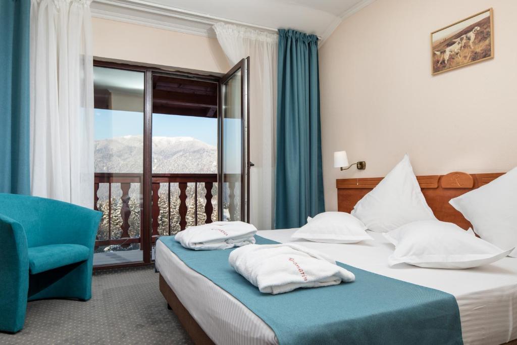 Postel nebo postele na pokoji v ubytování Hotel Rozmarin