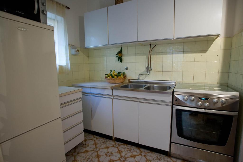Kuchyň nebo kuchyňský kout v ubytování Apartments Topo