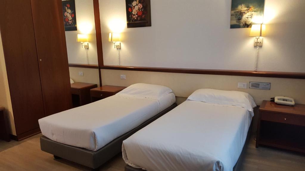 Postel nebo postele na pokoji v ubytování Green Hotel Motel