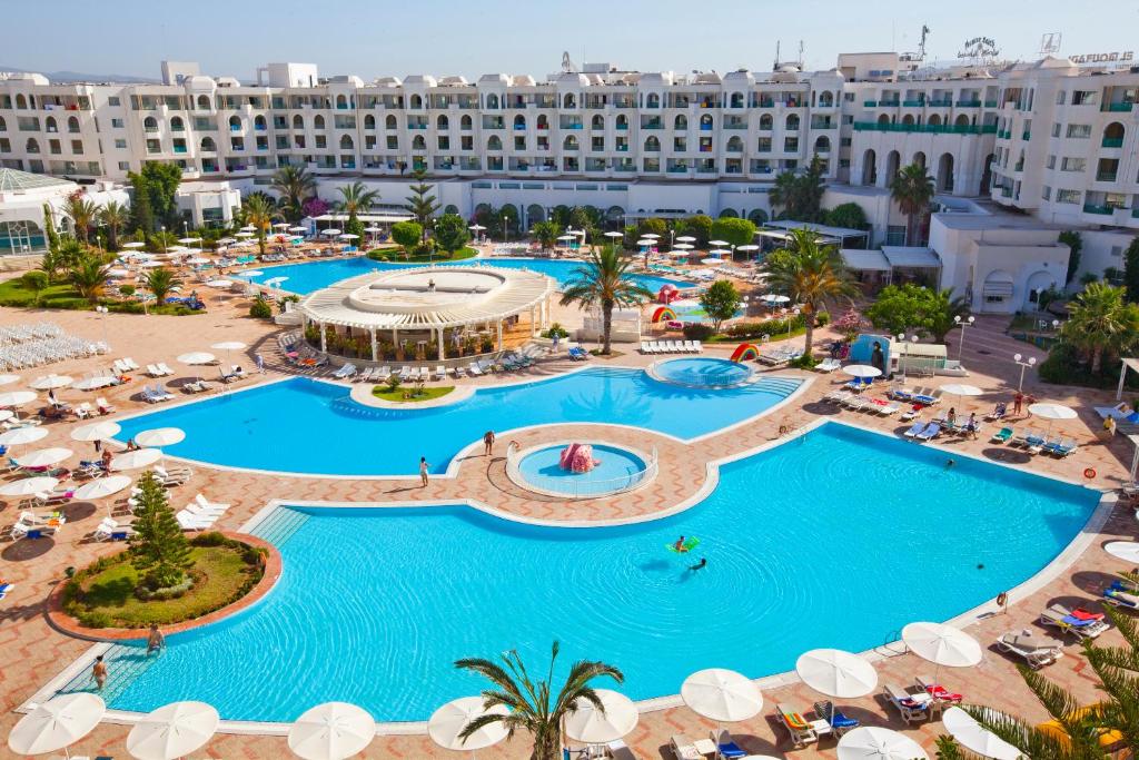 an aerial view of a hotel with two pools at El Mouradi El Menzah in Hammamet