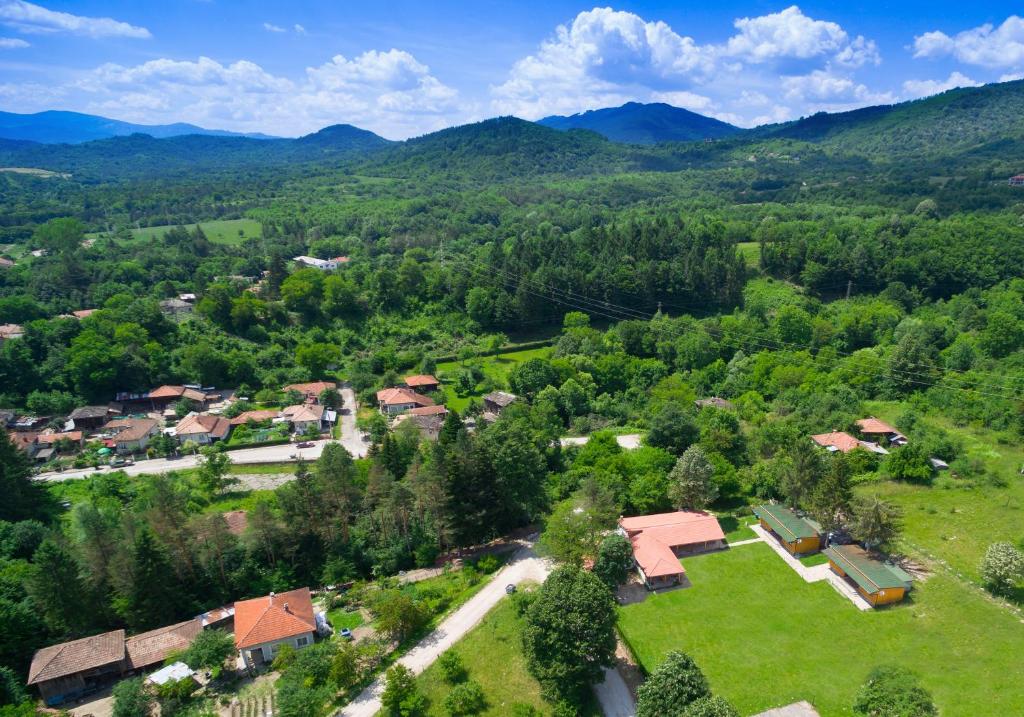 an aerial view of a small village in the mountains at Guest Houses Apriltsi in Kravenik