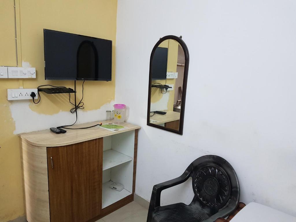 TV a/nebo společenská místnost v ubytování Jimmy Guest House