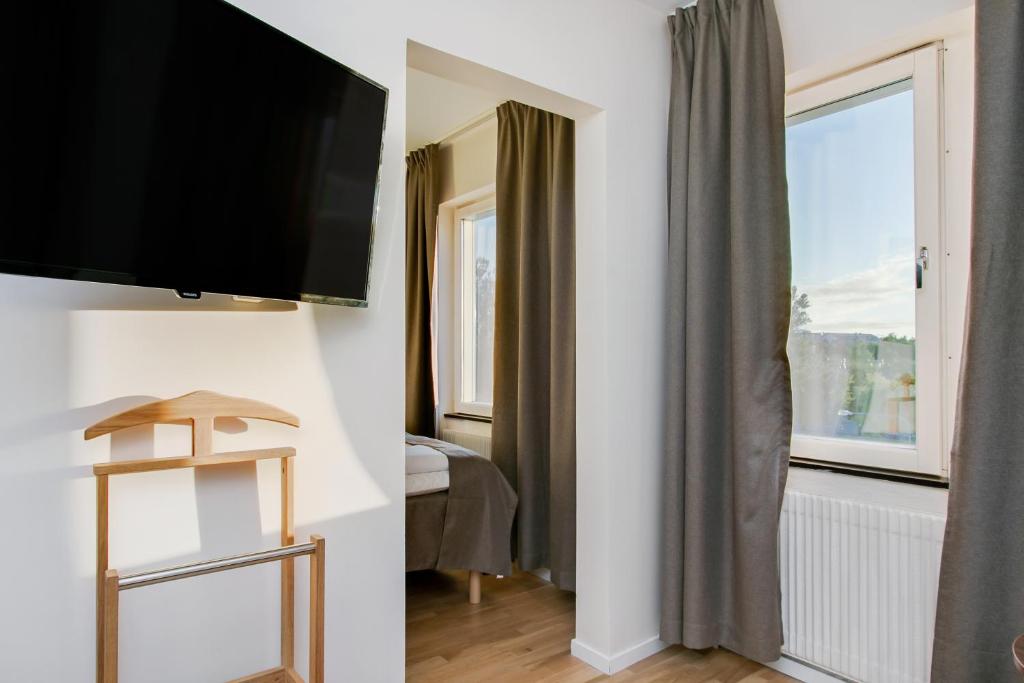 TV a/nebo společenská místnost v ubytování First Hotel Brommaplan