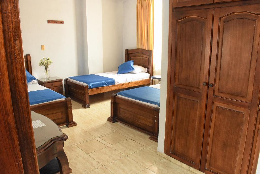 Postel nebo postele na pokoji v ubytování Hotel el Lago 2