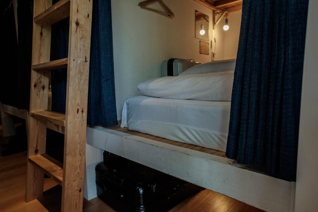 Postel nebo postele na pokoji v ubytování Blue Hour Kanazawa