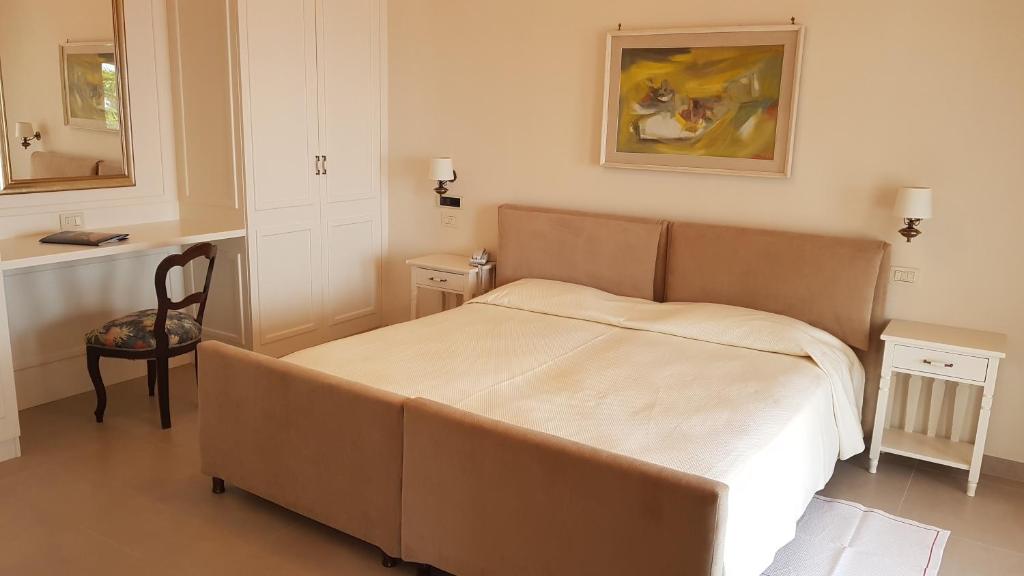 Postel nebo postele na pokoji v ubytování Grand Hotel San Michele