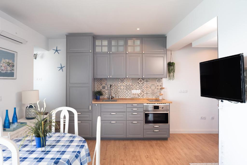 Kuchyň nebo kuchyňský kout v ubytování Apartamento Mediterraneo View