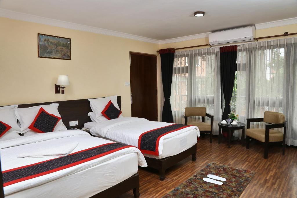 Postel nebo postele na pokoji v ubytování Taleju Boutique Hotel
