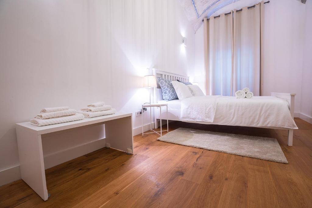 Posteľ alebo postele v izbe v ubytovaní Deluxe Apartment Talia