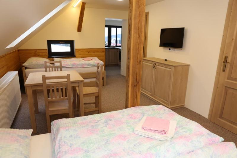 Postel nebo postele na pokoji v ubytování Apartmany Na Salasi