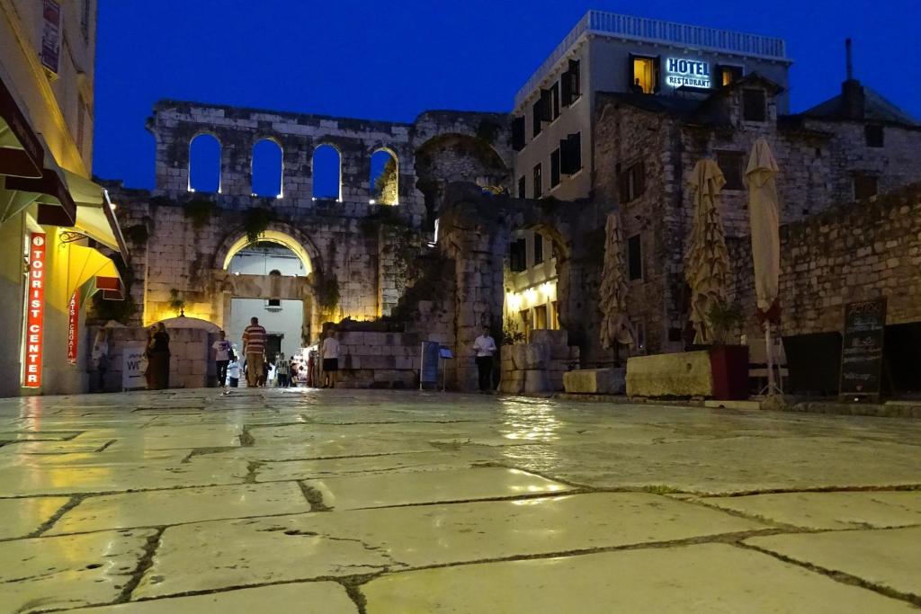 an empty street in an old building at night at Cvit Jadrana in Split