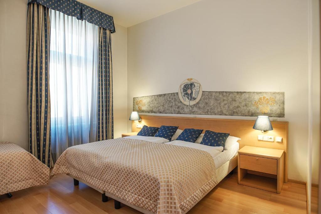Postel nebo postele na pokoji v ubytování Hotel Tivoli Prague