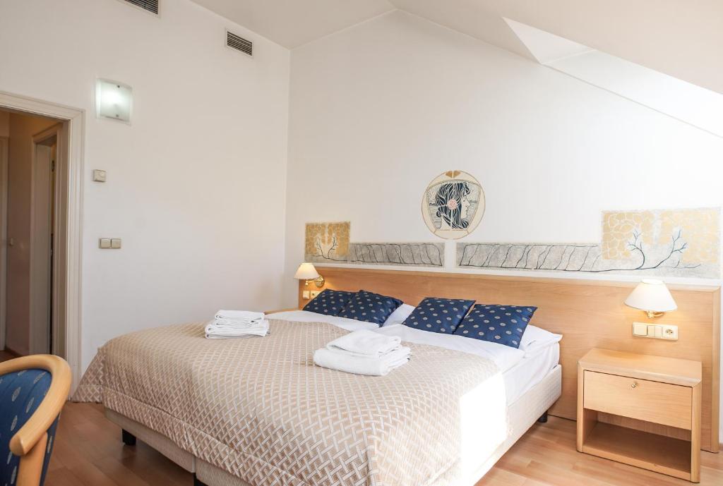 Postel nebo postele na pokoji v ubytování Hotel Tivoli Prague