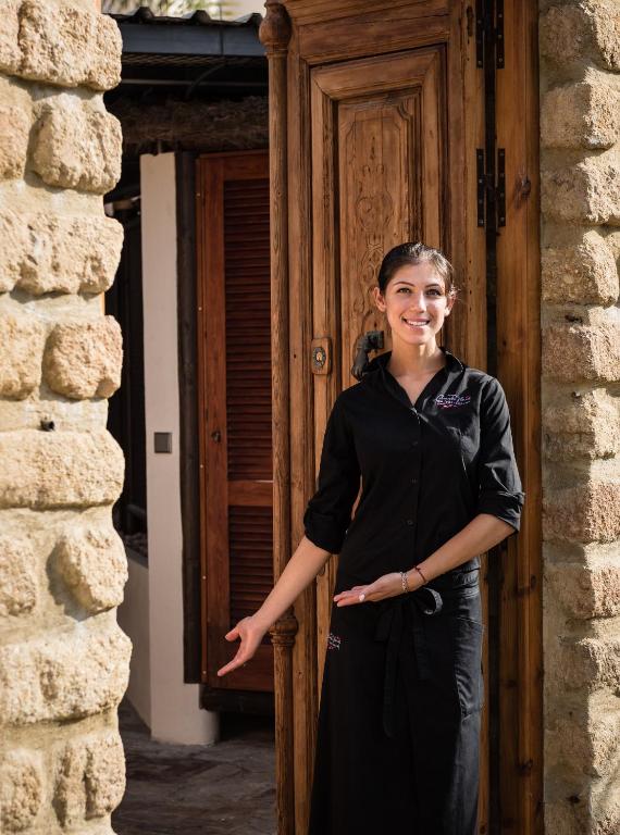 a woman standing in front of a door at The Residence by the Beach House Marbella in Marbella